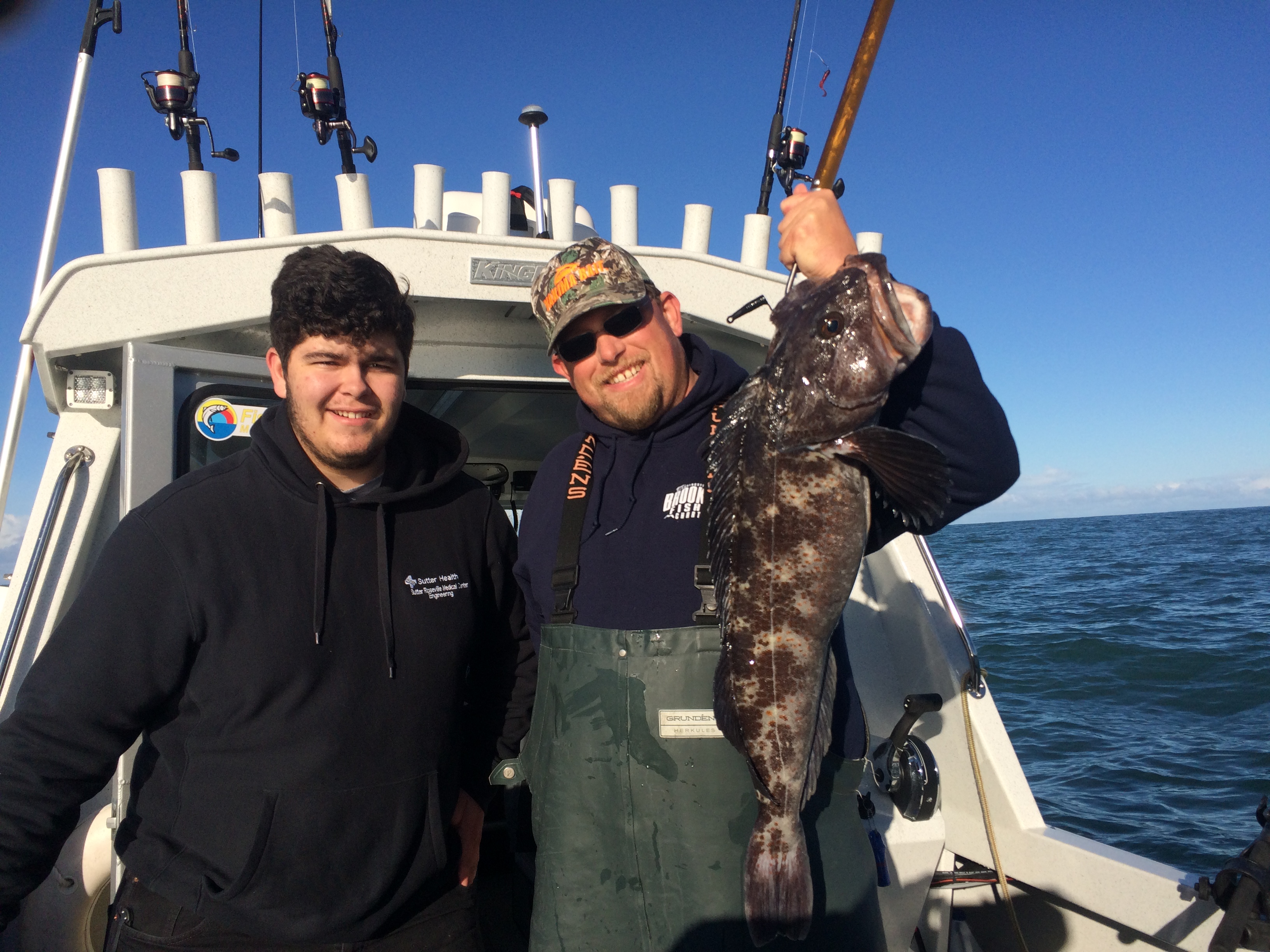Capt. Andy Martin holds the first lingcod of the season aboard the Miss Brooke.